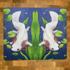 A mousepad featuring a colorful illustration of an axolotl floating in a pond, with green and blue tones predominating.