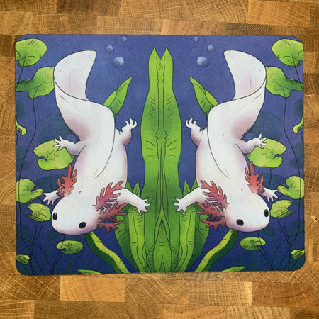A mousepad featuring a colorful illustration of an axolotl floating in a pond, with green and blue tones predominating.